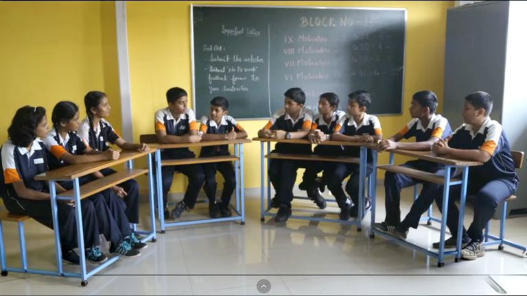 Students in classroom discussing road safety